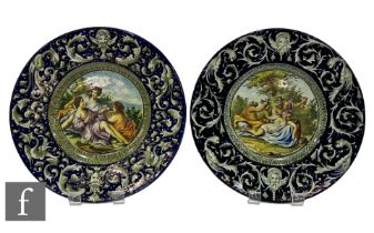 A near pair of 19th Century Italian Faience Ware charger in the manner of Cantagalli, each decorated