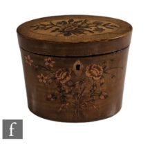 An early 19th Century sycamore oval tea caddy with marquetry floral detail to both the front and the