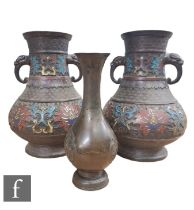 A collection of Chinese Late Qing Dynasty cast metal vases, to include two pear shaped examples