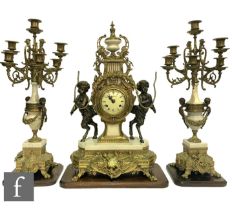 A late 20th Century Louis XVI style gilt clock garniture, the circular dial flanked by two bronze