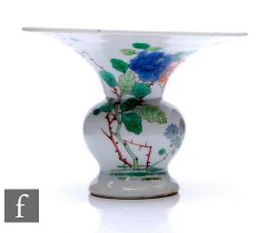 A Chinese enamelled (Daoguang period 1821-50) spitoon vase, of baluster form rising to a flared rim,