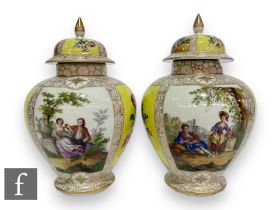 A pair of late 19th to early 20th Century Augustus Rex porcelain jars and covers of shouldered ovoid