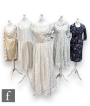 Five 1950s assorted lady's vintage dresses comprising a white cotton jacquard maxi summer dress with