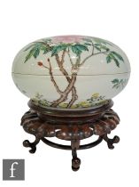 A Chinese famille rose lidded bowl, Qinalong seal mark but later, the white ground sparsely picked