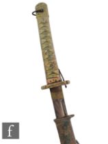 A World War Two Japanese Katana, simulated fish skin hilt, brass tsuba, metal scabbard, blade 68cm.