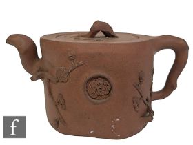 A Chinese Qing Dynasty 'Three Friends of Winter' Yixing teapot, the body moulded with prunus and