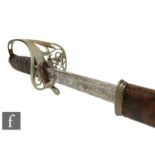 A George V artillery officer's dress sword, pierced brass guard and fish skin grip with leather