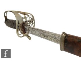 A George V artillery officer's dress sword, pierced brass guard and fish skin grip with leather