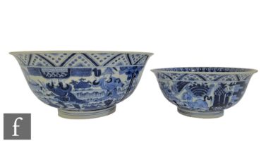 Two Chinese Kangxi style blue and white bowls, each of 'U' form, the exterior of each decorated with