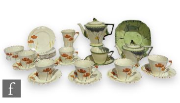 A 1930s Art Deco Myott Son & Co tea service of angular form with triangular handles, hand painted