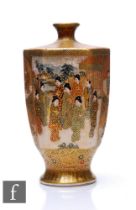 A Japanese Satsuma vase of ovoid hexagonal from, rising from a splayed base, the heavily gilded body