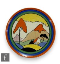 A boxed Wedgwood Clarice Cliff hand painted charger decorated in the Fantasque Mountain pattern,