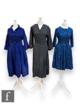 Three lady's vintage dresses comprising a three quarter sleeve cotton midi dress with geometric