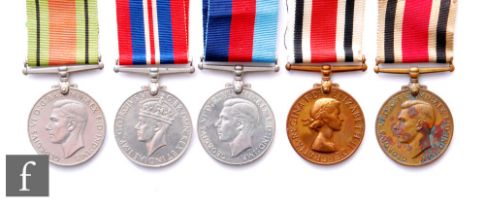 Two World War Two Defence medals with a 39-45 British War and George VI and Elizabeth II Special