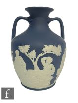 A later 20th Century Wedgwood copy of the Portland Vase, blue jasper dip with relief figures