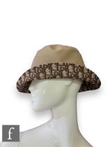 A Christian Dior reversible Teddy-D small brim bucket hat, in a reversible camel cotton mix fabric