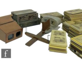 Two hand held Stereoscopic viewers, damaged, and a large collection of slides. (qty)