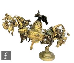 An early 20th Century French ceiling light fitting of conical fluted gilt form, mounted with three