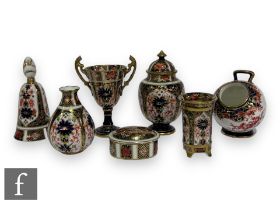 A small collection of 20th Century Royal Crown Derby porcelain items to comprise a table bell,