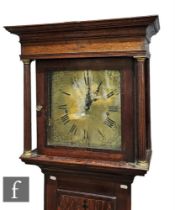 A late 18th Century oak and mahogany crossbanded longcase clock with eight-day movement striking