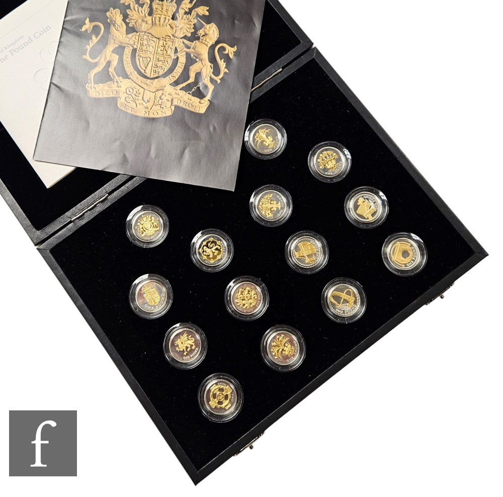 A set of Elizabeth II Royal Mint one pound coins to commemorate the 25th Anniversary, silver proof