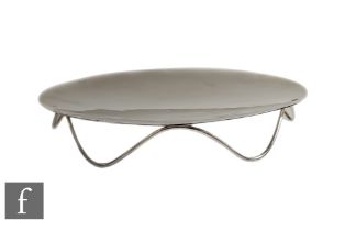 A hallmarked silver circular dish raised on a six strut wire work base, weight 10oz, diameter