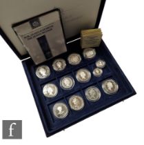 An Elizabeth II Royal Mint silver proof commemorative coin collection, eleven five pound coins and