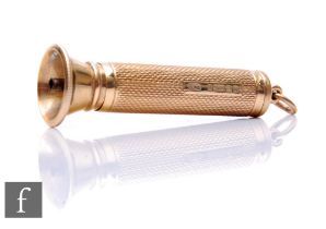 A 9ct hallmarked cigar piercer with engine turned decoration, weight 15g, length 5cm, terminating in
