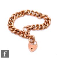 A 9ct rose gold open curb link bracelet, weight 17.5g, terminating in padlock fastener, some damage.