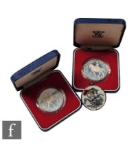 Two Elizabeth II 1977 Silver Jubilee crowns each boxed with certificates and an 1888 enamelled