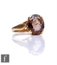 A 9ct hallmarked smoky quartz single stone ring, claw set oval stone, weight 3.3g, ring size O.