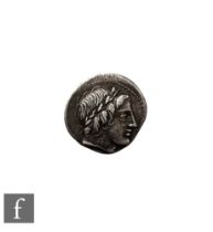 A Roman Denarius 86 BC, Rome head of Apollo to the right, the reverse Jupiter in fast quadriga to