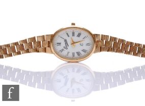 A lady's 9ct hallmarked Everite wrist watch, Roman numerals to a white oval dial to an integral