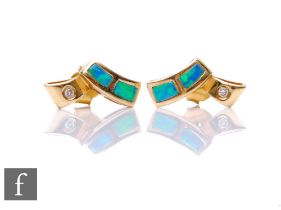 A pair of 14ct opal and diamond stud earrings each with two opal panels and a single diamond, weight