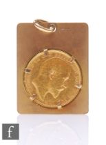 An Edward VII sovereign dated 1907, claw set to a 9ct pendant mount, total weight 13g.