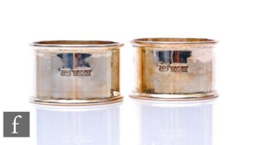 Two hallmarked silver circular napkin rings of plain form, total weight 2.35oz, Birmingham 1970.