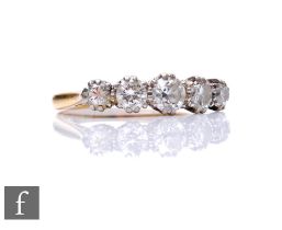 An 18ct diamond five stone ring, graduated brilliant cut stones, total weight approximately 1.