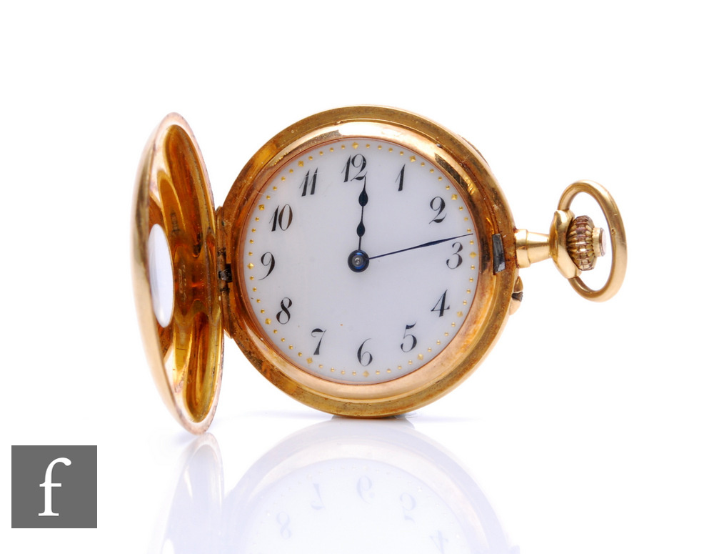 An 18ct half hunter, crown wind pocket watch with Arabic numerals to the outer case and white
