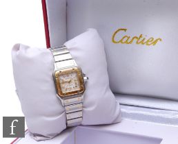 A lady's stainless steel Cartier Santos wrist watch, Ref 2423. Roman numerals and date