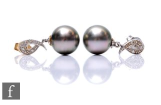 A pair of 9ct hallmarked white gold black cultured pearl and diamond drop earrings, diameter of pear