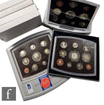 Two Elizabeth II 2000 Millennium proof sets, a 2001 Executive proof collection and a collection of