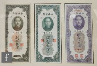 A framed group of three Chinese 10, 20 and 50 custom gold unit bank notes, a similar framed group of