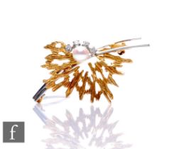 An 18ct hallmarked white and yellow gold diamond and cultured pearl modernist brooch, weight 7.7g,