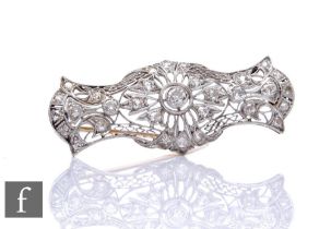 An 18ct white gold diamond brooch filigree shaped rectangular body highlighted with old cut