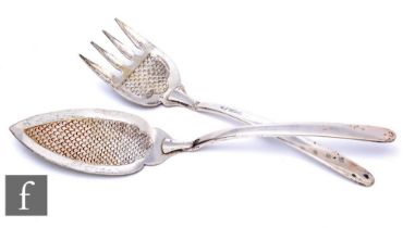 A pair of hallmarked silver fish servers, each with scale decoration and terminating in plain