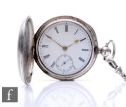 A hallmarked silver full hunter key wind pocket watch, Roman numerals to a white enamelled dial,