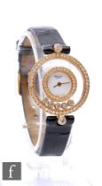 A lady's 18ct Chopard Happy Diamonds wrist watch, Ref 4097, circular white dial within twin border