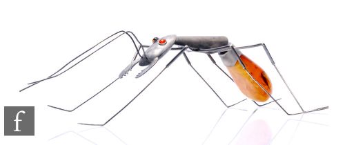 An artisan produced white metal and amber model of an ant, the abdomen of the ant formed from a