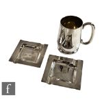 A hallmarked silver small tankard with a pair of silver hallmarked ashtrays, total weight 9oz,