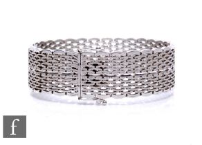 An 18ct white gold matt finished mesh link bracelet, weight 42.5g, length 18cm, terminating in